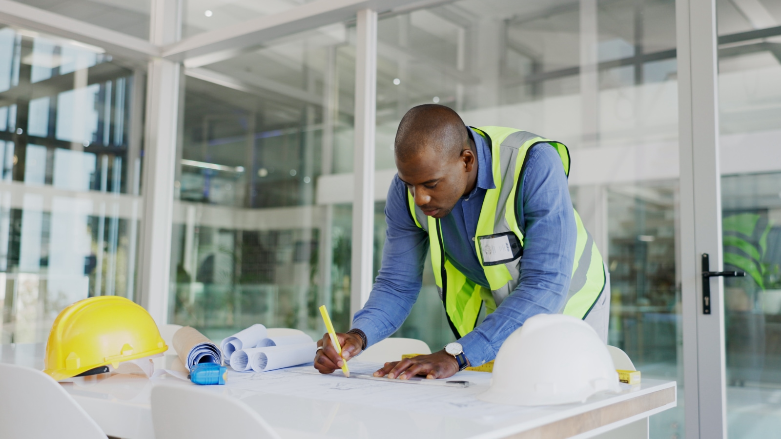 June 4 blog construction contractor working on blue print